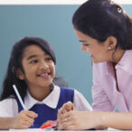 Teacher,And,Student,Smile,At,Each,Other